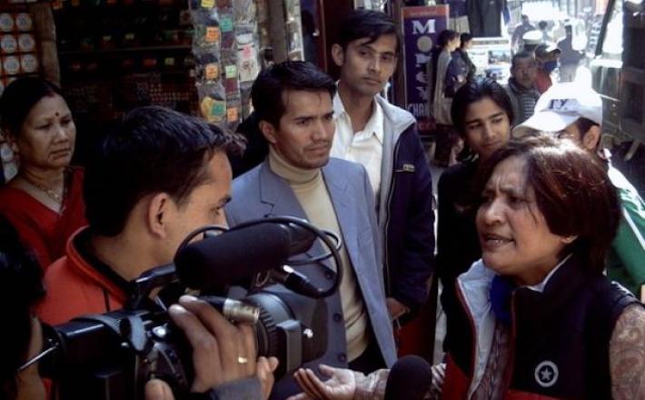 Hisila Yami being interviewed by AP about a Maoist garbage removal program in Thamel, Kathmandu, October 8, 2010. Credit: Wikimedia Commons/ Neil Horning