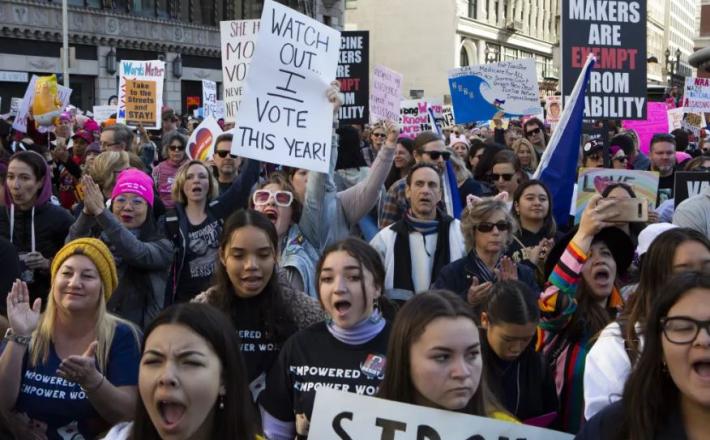 LOS ANGELES, CA-JANUARY 18, 2019: Supporters cheer during the 4th annual Women’s March Los Angeles kickoff at Pershing Square in dowtown Los Angeles. (Gabriella Angotti-Jones/Los Angeles Times)