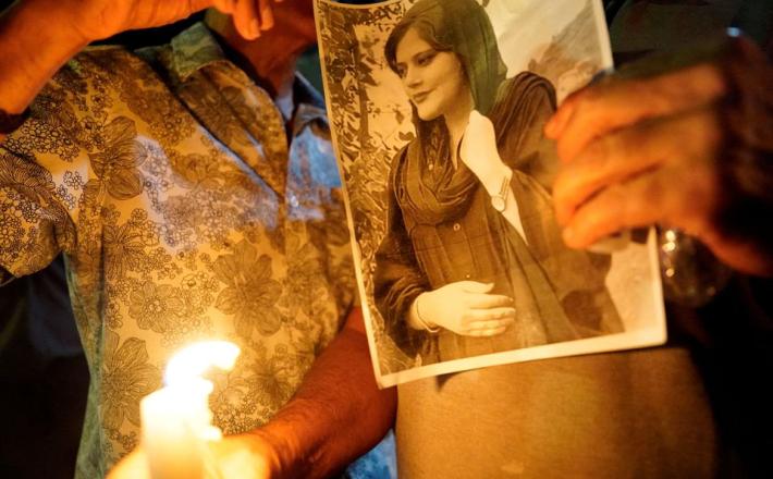 A image of Zhina Mahsa Amini at a candlelit vigil following her death, outside the Wilshire Federal Building in Los Angeles, California, U.S., September 22, 2022. REUTERS/Bing Guan/File Photo
