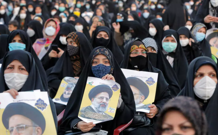 Women supporters of Iran's presidential election favourite, ultraconservative judicary chief Ebrahim Raisi, attend a campaign rally in the city of Eslamshahr, just south of Tehran - AFP/File