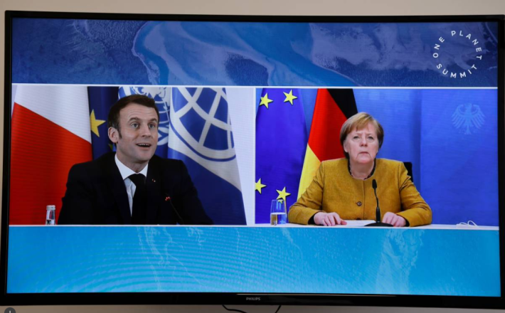 French President Emmanuel Macron and German Chancellor Angela Merkel attend a video conference at The Elysee Palace in Paris, France, January 11, 2021. Ludovic Marin/Pool via REUTERS