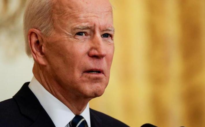 FILE PHOTO: U.S. President Joe Biden speaks to reporters as he holds his first formal news conference in the East Room of the White House in Washington, U.S., March 25, 2021. REUTERS/Leah Millis