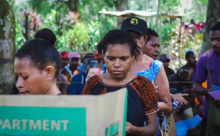 A woman queues to vote on the Rai coast in Madang, Papua New Guinea. Female candidate Kessy Sawang says: ‘Women shy away from running for elections because of this mindset that it is for men only.’ Photograph: Godfreeman Kaptigau/The Guardian