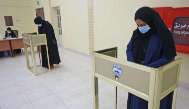 Kuwaiti women cast their ballots at a polling station during parliamentary elections in Kuwait City on December 5, 2020. (AFP)