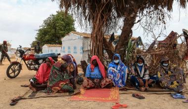 FILE - A group of women take shelter under a tree a the Bogo IDP camp in Maroua, Cameroon, April 28, 2022.