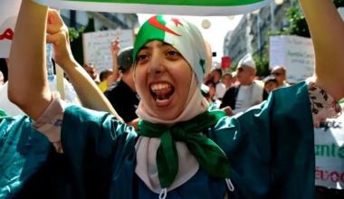Morocco World News - Algerian woman during a protest in the country's capital Algiers. Credit: Ryad Kramdi/AFP