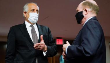 Zalmay Khalilzad, special envoy for Afghanistan Reconciliation, talks with U.S. Senator Chris Coons (D-DE), before the start of a Senate Foreign Relations Committee hearing on Capitol Hill in Washington, U.S., April 27, 2021. Susan Walsh/Pool via REUTERS