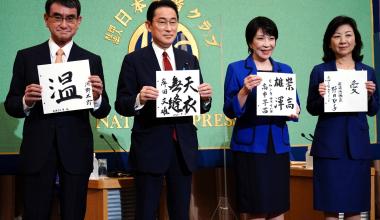 Candidates for the ruling Liberal Democratic Party's presidential election pose with slogans written in kanji prior to a debate at the Japan National Press Club in Tokyo on Saturday. | POOL / VIA REUTERS