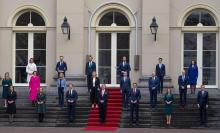 Dutch King Willem-Alexander (C) and Prime Minister Mark Rutte pose for a photo with other ministers of the new the government AP Photo/Peter Dejong