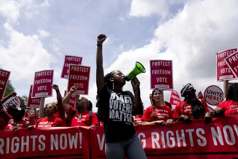 Demonstrators march during a Freedom Ride for Voting Rights rally in Washington on June 26, 2021.Stefani Reynolds / Bloomberg via Getty Images file