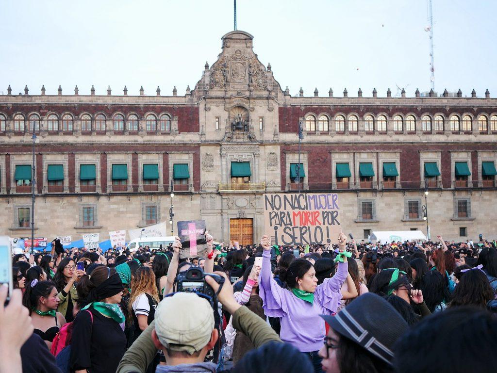 Protesters at a femicide protest in Zocalo, Mexico City, the day after International Day for the Elimination of Violence Against Women in 2019. (Wikimedia Commons)