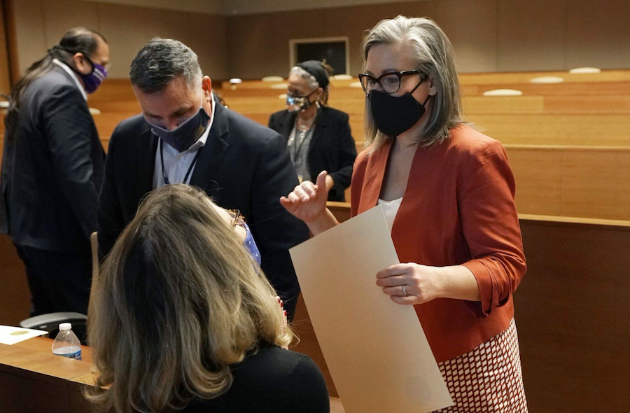 Arizona Secretary of State Katie Hobbs, right, talks with members of the Electoral College after the Arizona election was certified on December 14, 2020, in Phoenix. (AP/ROSS D. FRANKLIN)