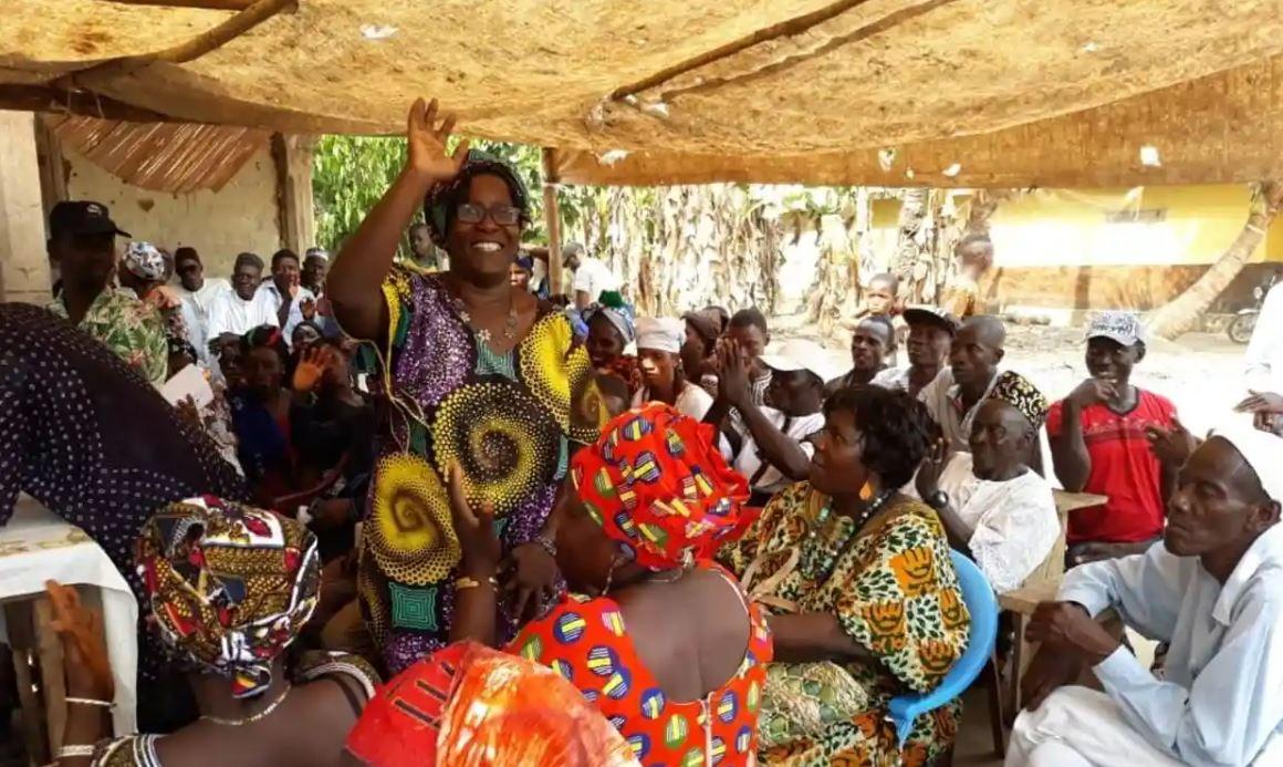 Femi Claudius Cole chats with locals at the Congo Town market in the capital, Freetown. ‘I have a responsibility,’ she says. ‘I belong to these people.’ Photograph: Freetown city council